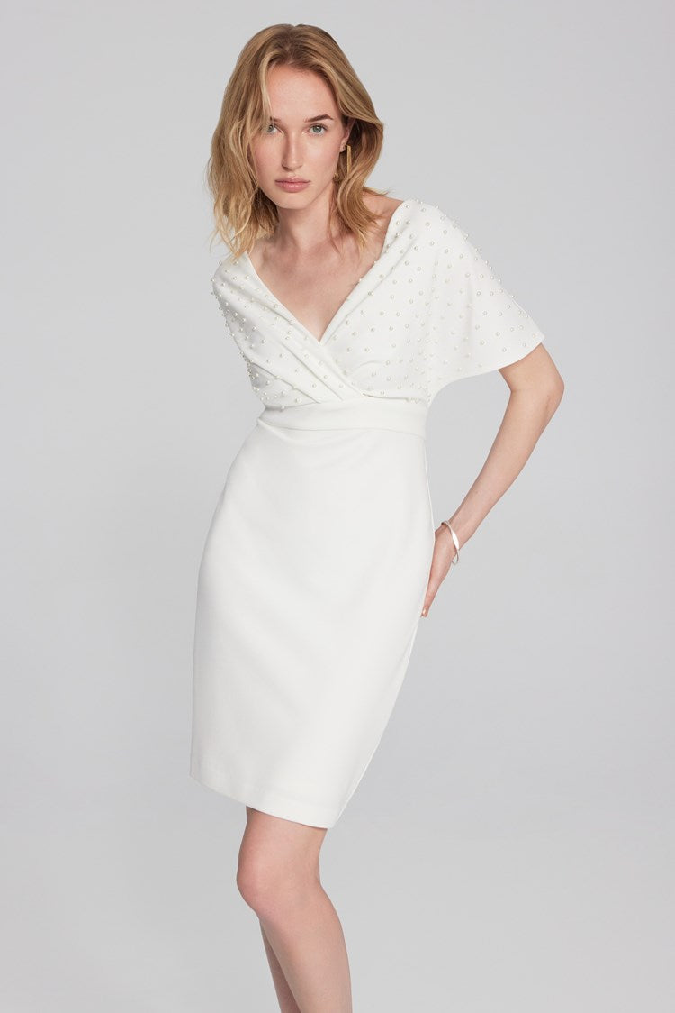 Joseph Ribkoff scuba crepe gown: trumpet skirt, ruffle, slit; wrap neckline, V-shaped back exude sophistication. Ideal for special occasions.