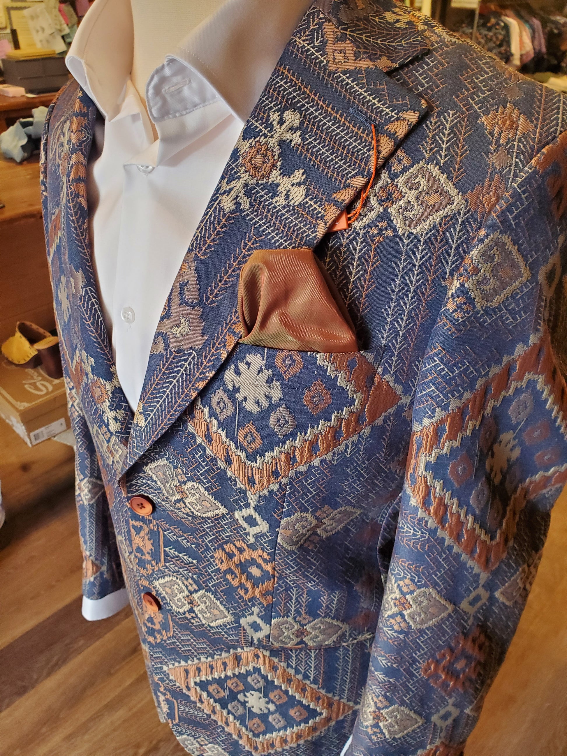 Fancy jacquard embroidered blue and bronze specialty sports jacket, cut to order. Mackinac Island boutique
