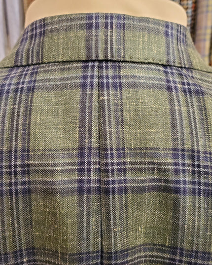 Green and blue plaid fabric on a mannequin