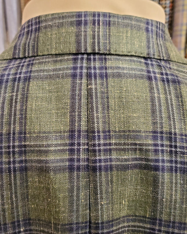Green and blue plaid fabric on a mannequin