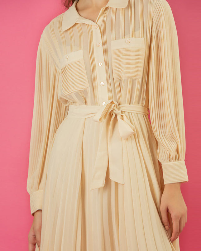 Jessie Liu Collection. Pleated button-down shirt dress. Beige color. 100% Polyester. Summer dress. Available at Rustic Chic Boutique, Mackinac Island Michigan.