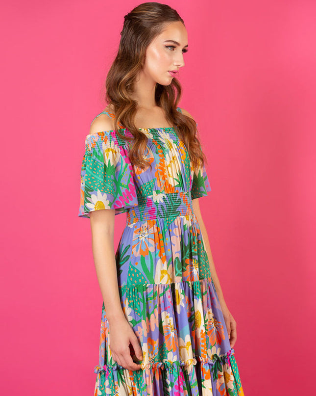 Jessie Liu Collection. 100% Silk. Summer floral print optional cold shoulder tiered dress with smocking details on the shoulder and waist. Summer dress. Available at Rustic Chic Boutique, Mackinac Island Michigan