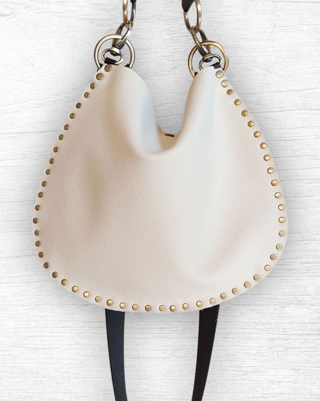 Rebellion Handbags, made in Chicago, IL. Off white - cream colormedium crossbody, napa leather, antique brass hardware, available at Rustic Chic Boutique, Mackinac Island Michigan