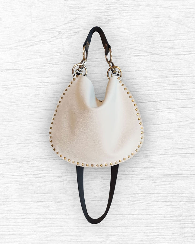 Rebellion Handbags, made in Chicago, IL. Off white - cream color medium crossbody, napa leather, antique brass hardware, available at Rustic Chic Boutique, Mackinac Island Michigan
