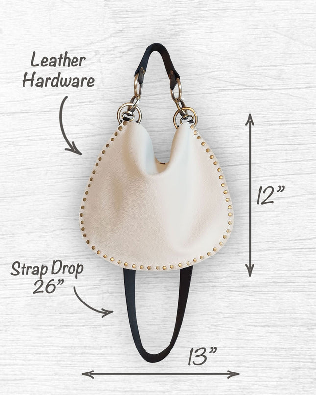 Rebellion Handbags, made in Chicago, IL. Off white - cream color medium crossbody, napa leather, antique brass hardware, available at Rustic Chic Boutique, Mackinac Island Michigan